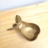 Pear-shaped pocket emptier in gilded brass