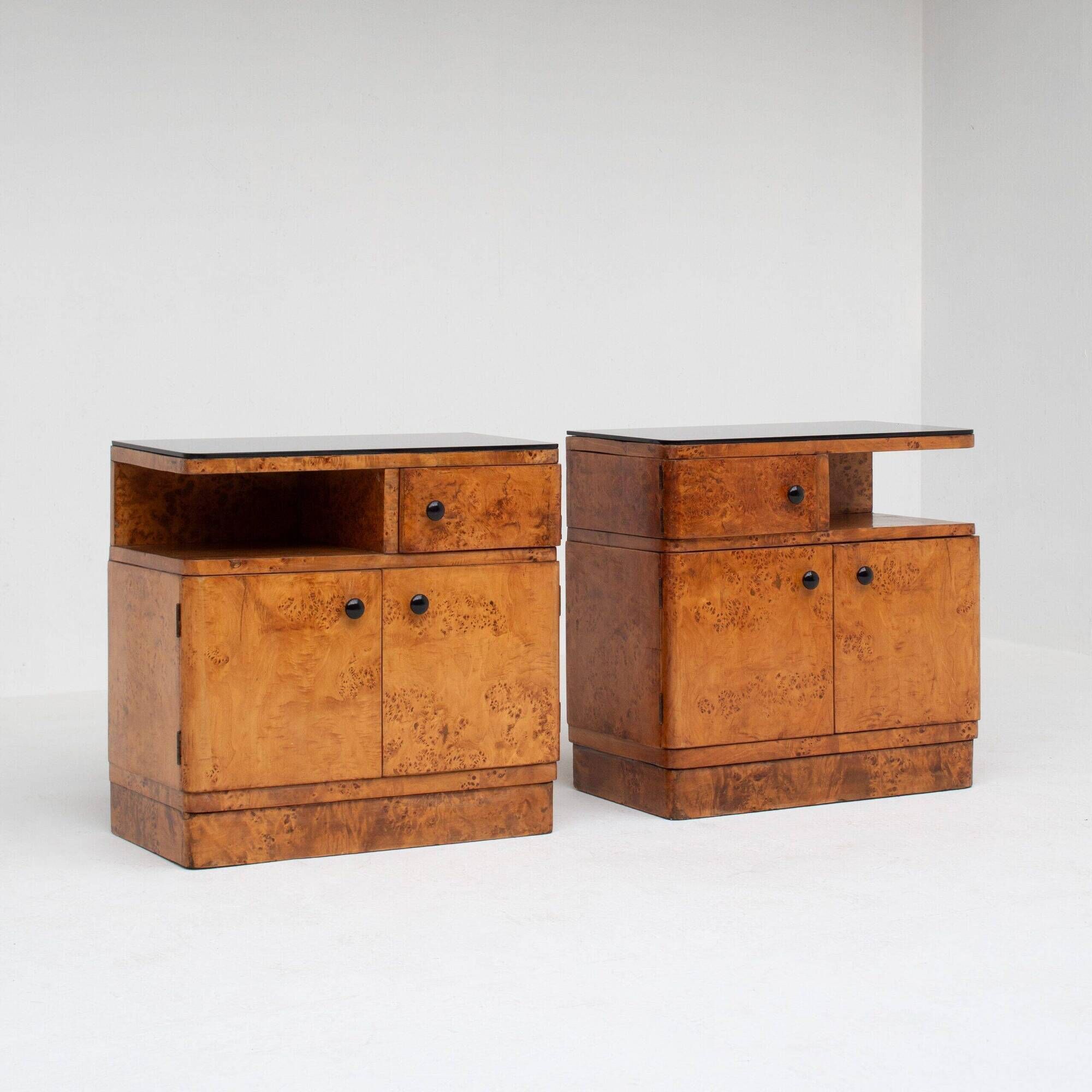 Pair of Art Deco nightstands in burlwood with black lacquered top