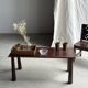 Table basse en teck brun de seconde main indonésienne pieds coniques H37 L8