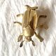 Vintage golden brass scarab