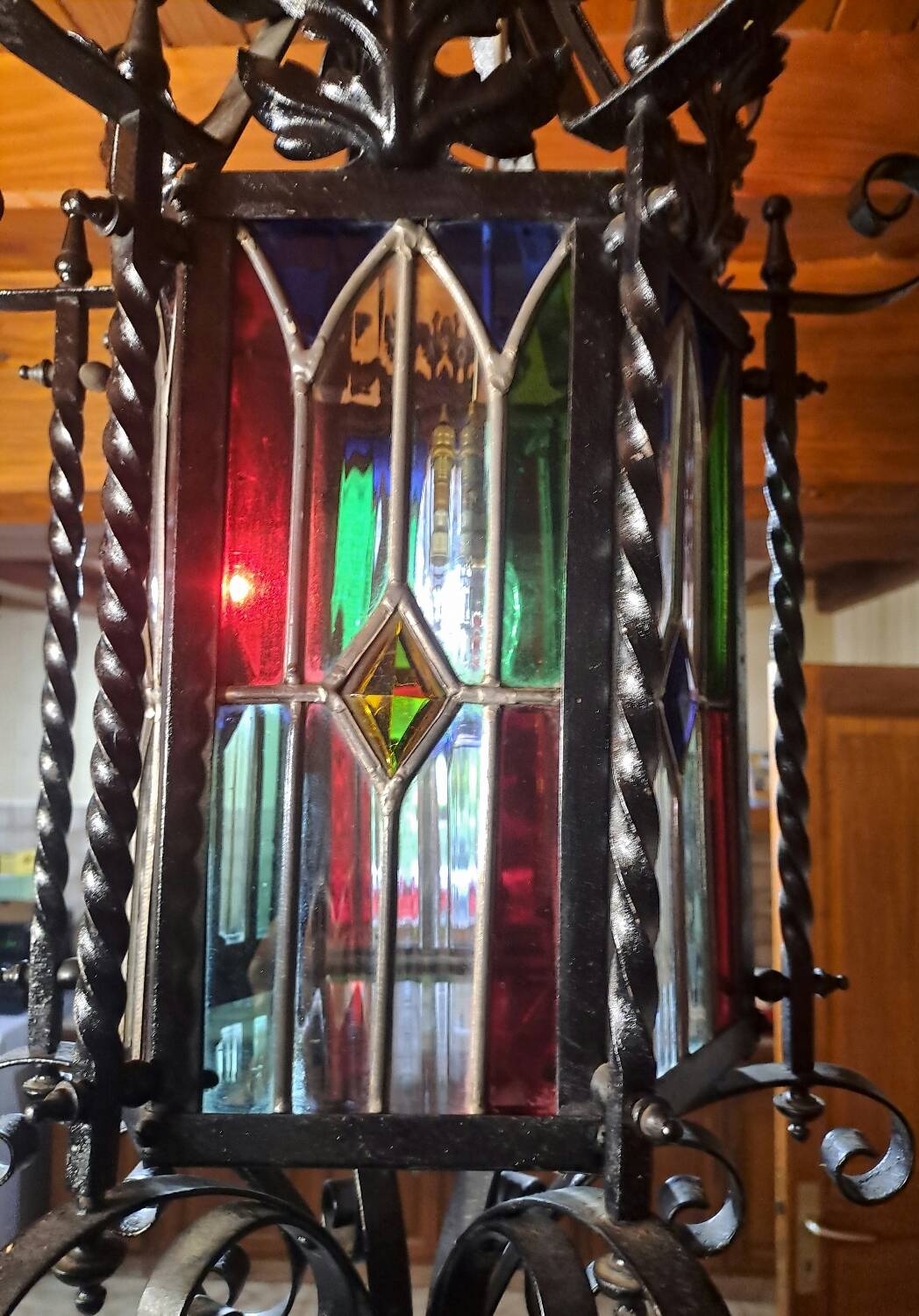 Wrought iron lantern with colored stained glass