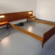 Double bed in vintage Scandinavian style from the 1960s with bedside tables.
