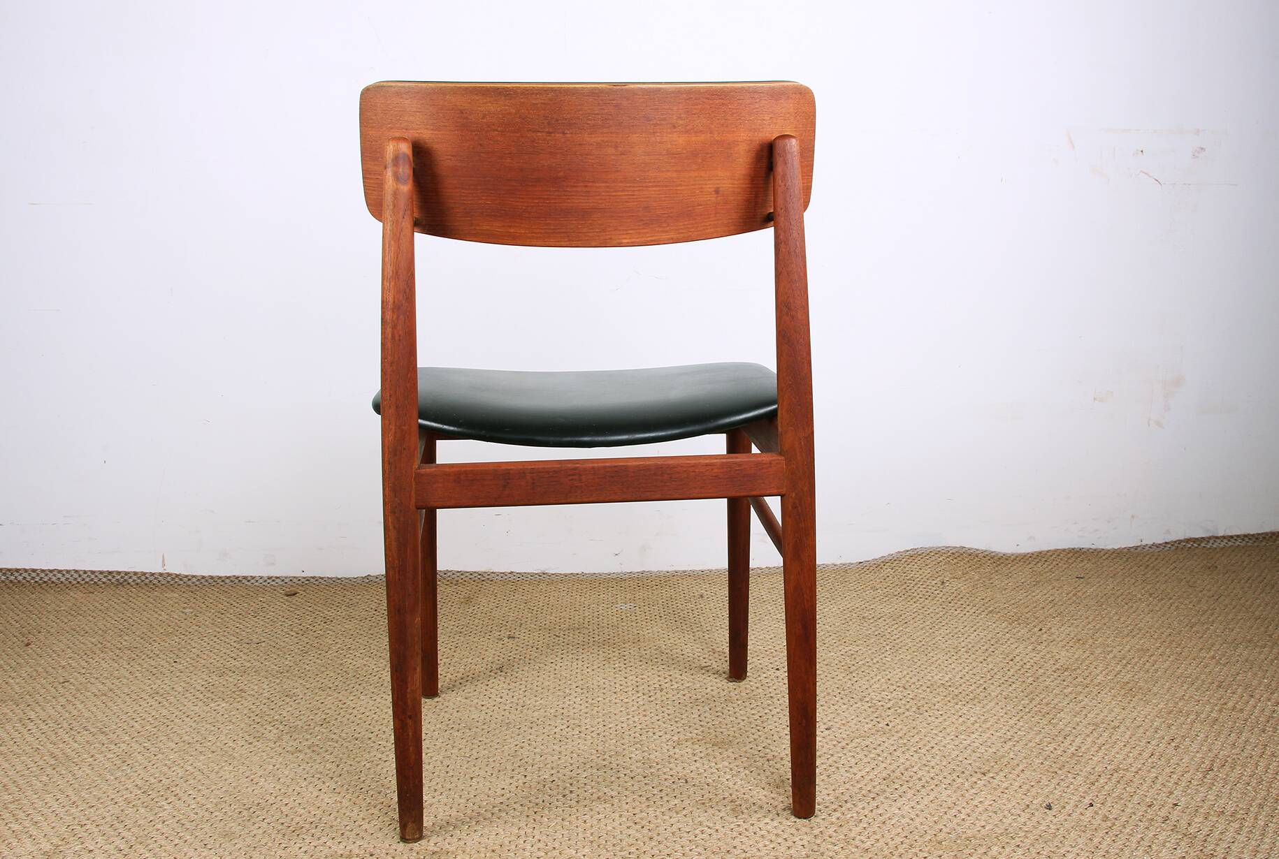 Set of 8 Danish chairs in teak, black leatherette and brass, Sven Chrobat/Sax.