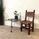 Spanish chair in leather and carved wood, 1950s/60s.