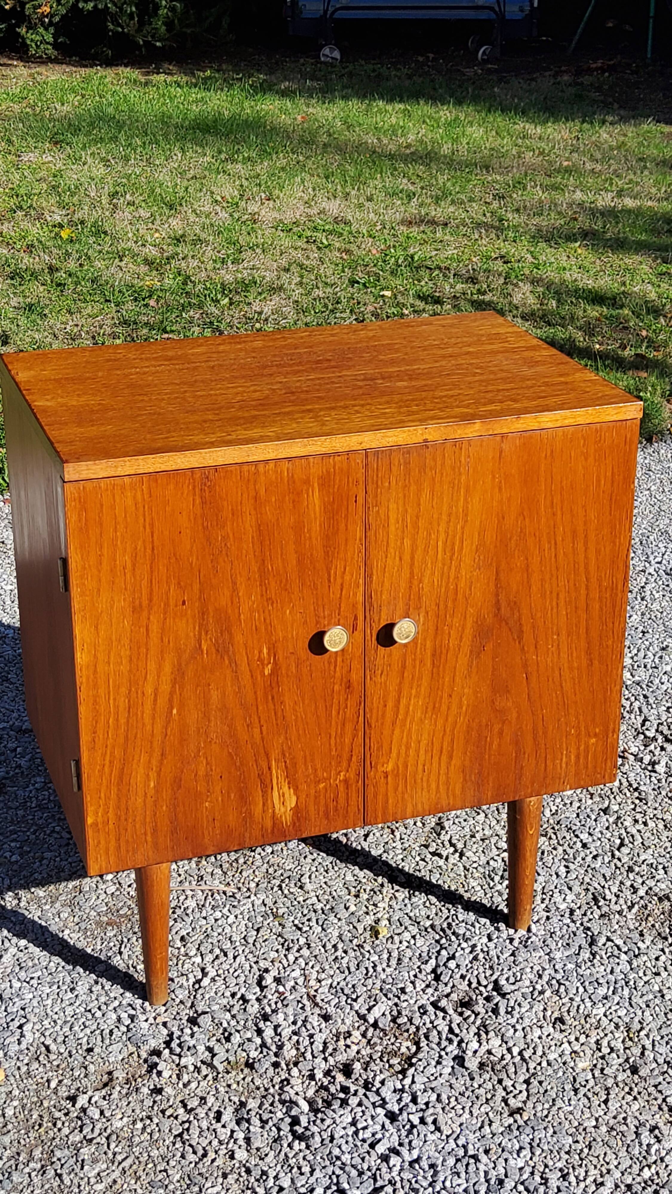 Vintage golden oak sideboard with conical legs from the 1950s