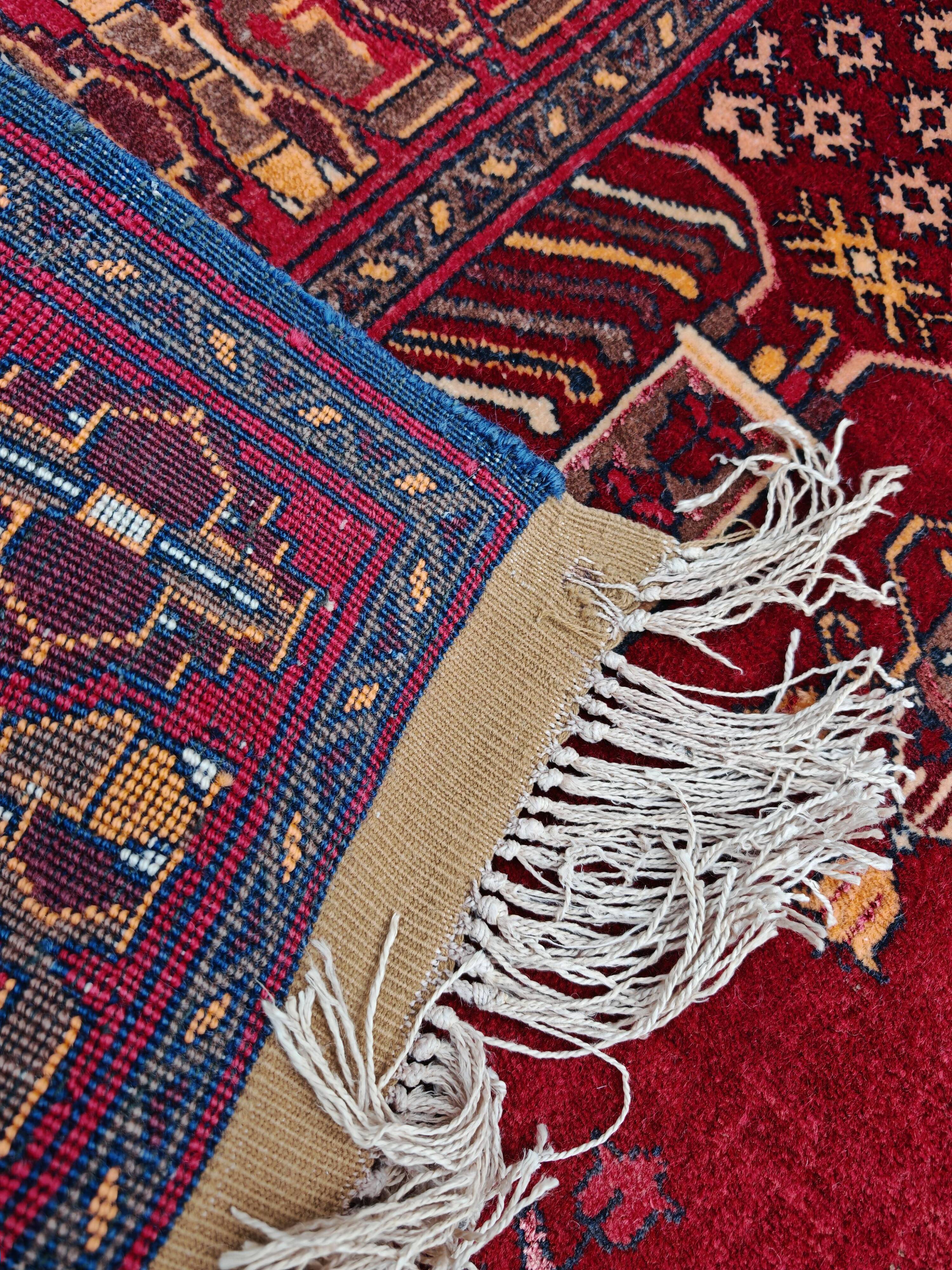 Vintage Afghan hand-knotted prayer rug with Islamic patterns.