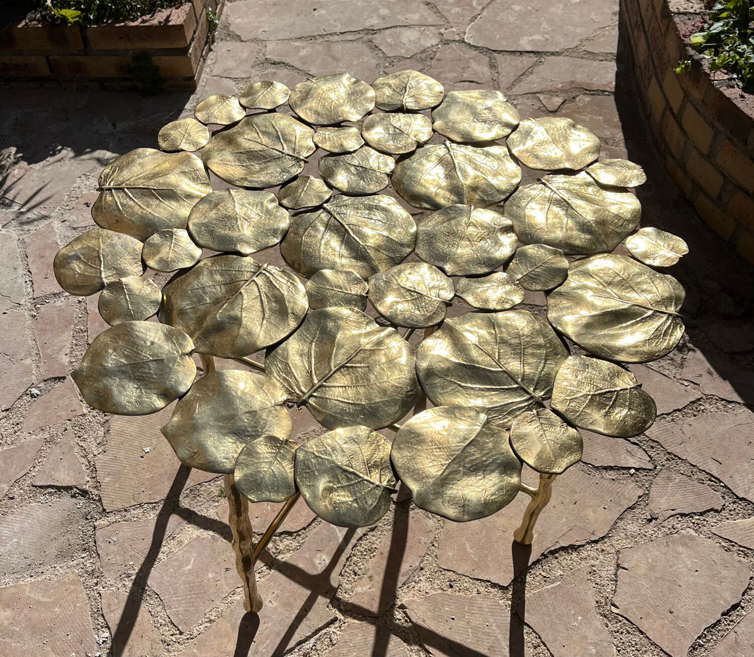 Carved brass coffee table with ginkgo decor