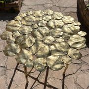 Carved brass coffee table with ginkgo decor