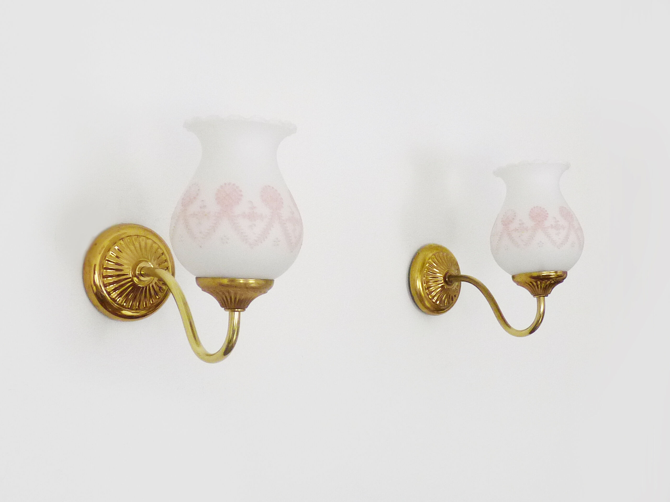 Pair of gooseneck wall sconces in gilded metal, white opaline with pink decorations