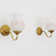 Pair of gooseneck wall sconces in gilded metal, white opaline with pink decorations