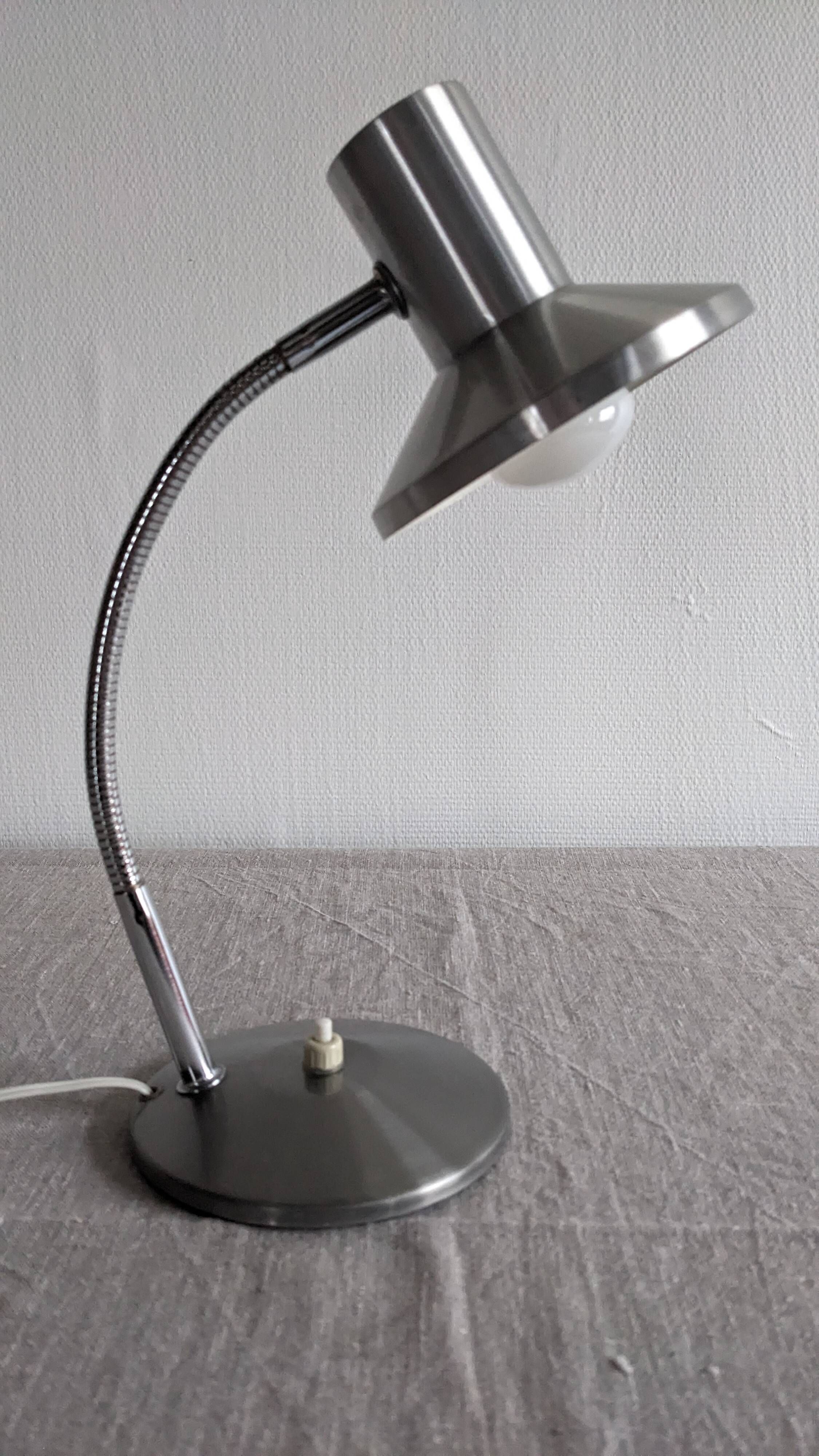 Articulated bedside lamp or wall light in aluminium, France circa 1960.