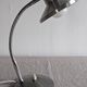 Articulated bedside lamp or wall light in aluminium, France circa 1960.