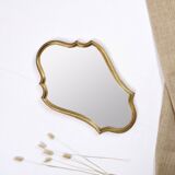 Old wooden mirror gilded with gold leaf