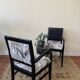 Black wooden armchair with golden leaves