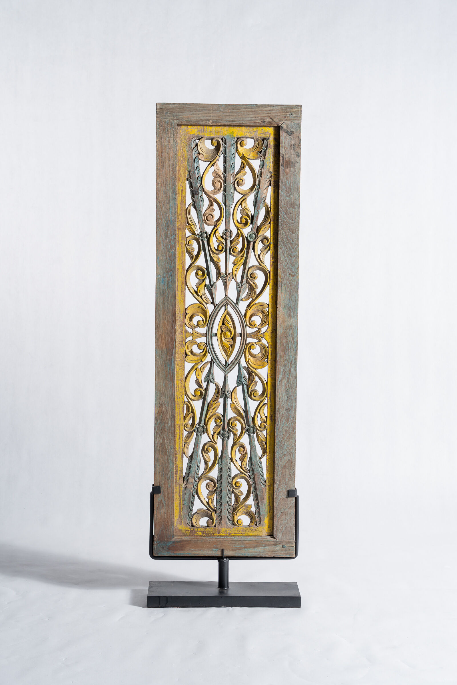Rectangular Indonesian construction element with blue and yellow plant in carved wood