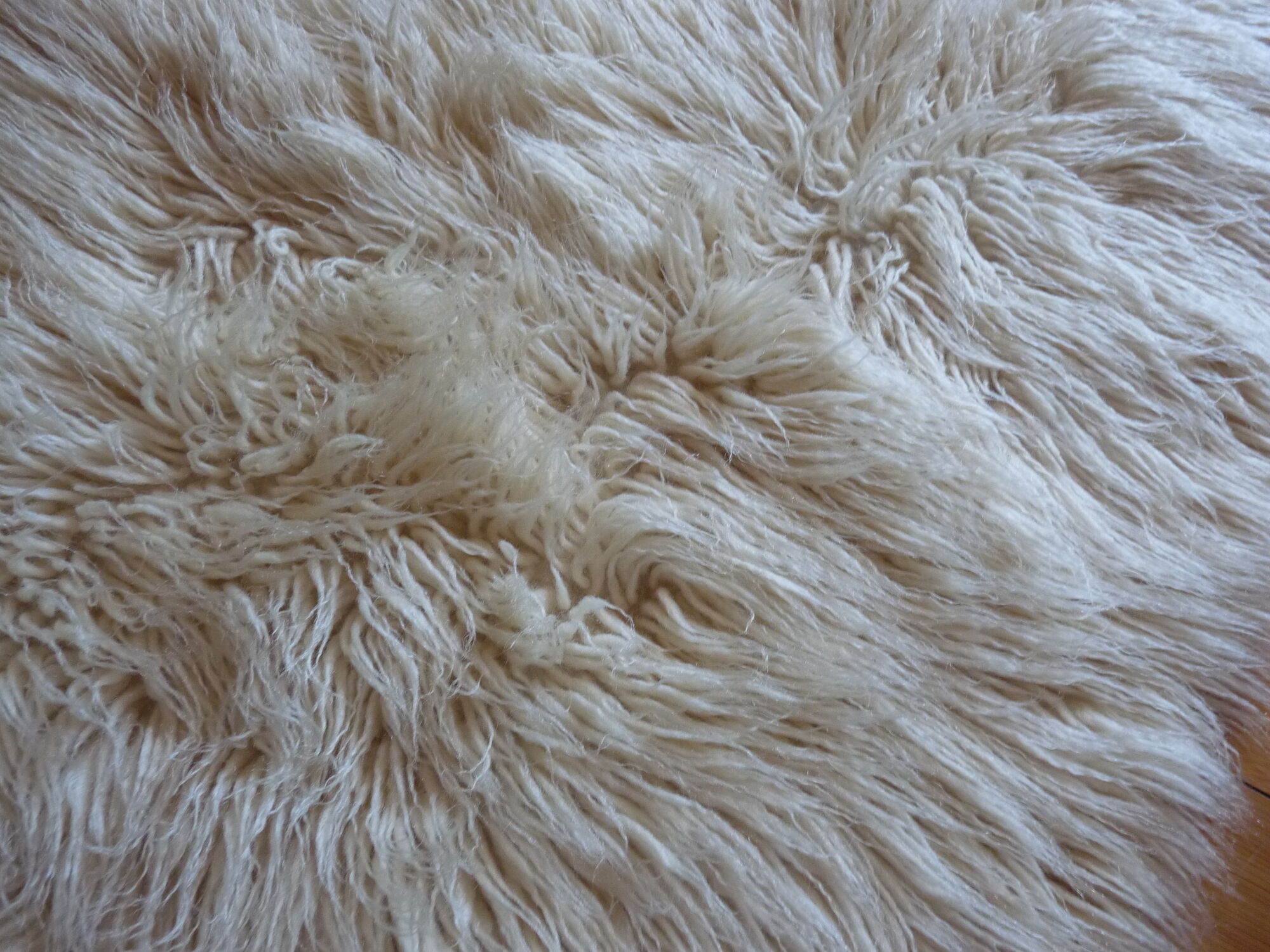 Tapis à longs poils et en pure laine - 105x70cm