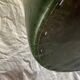 Pouf vintage rond en Skaï vert