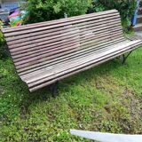 Old wooden bench and wrought iron