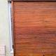 Vintage 1940s secretary desk with wooden curtains, storage, and shutters.