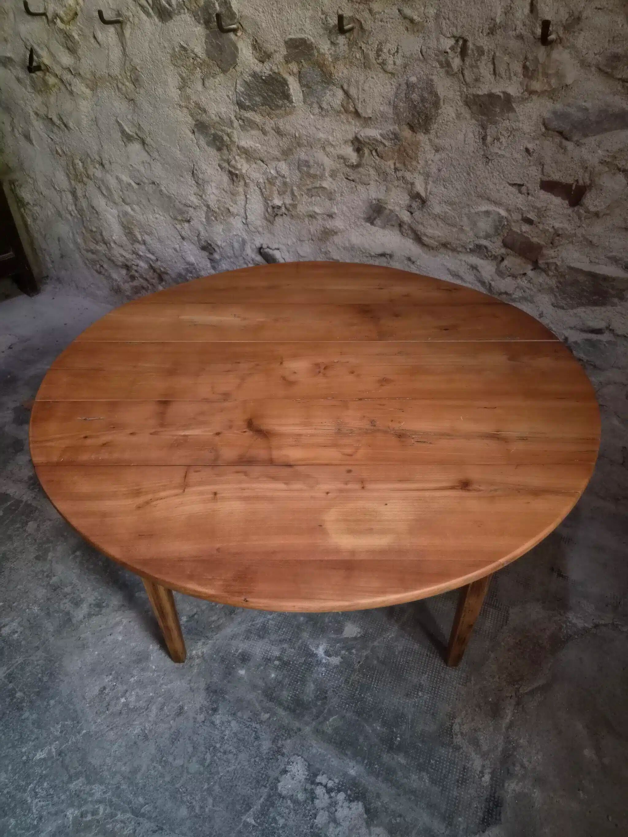 Rustic French antique dining table, drop-leaf table in cherry wood, circa 1900.