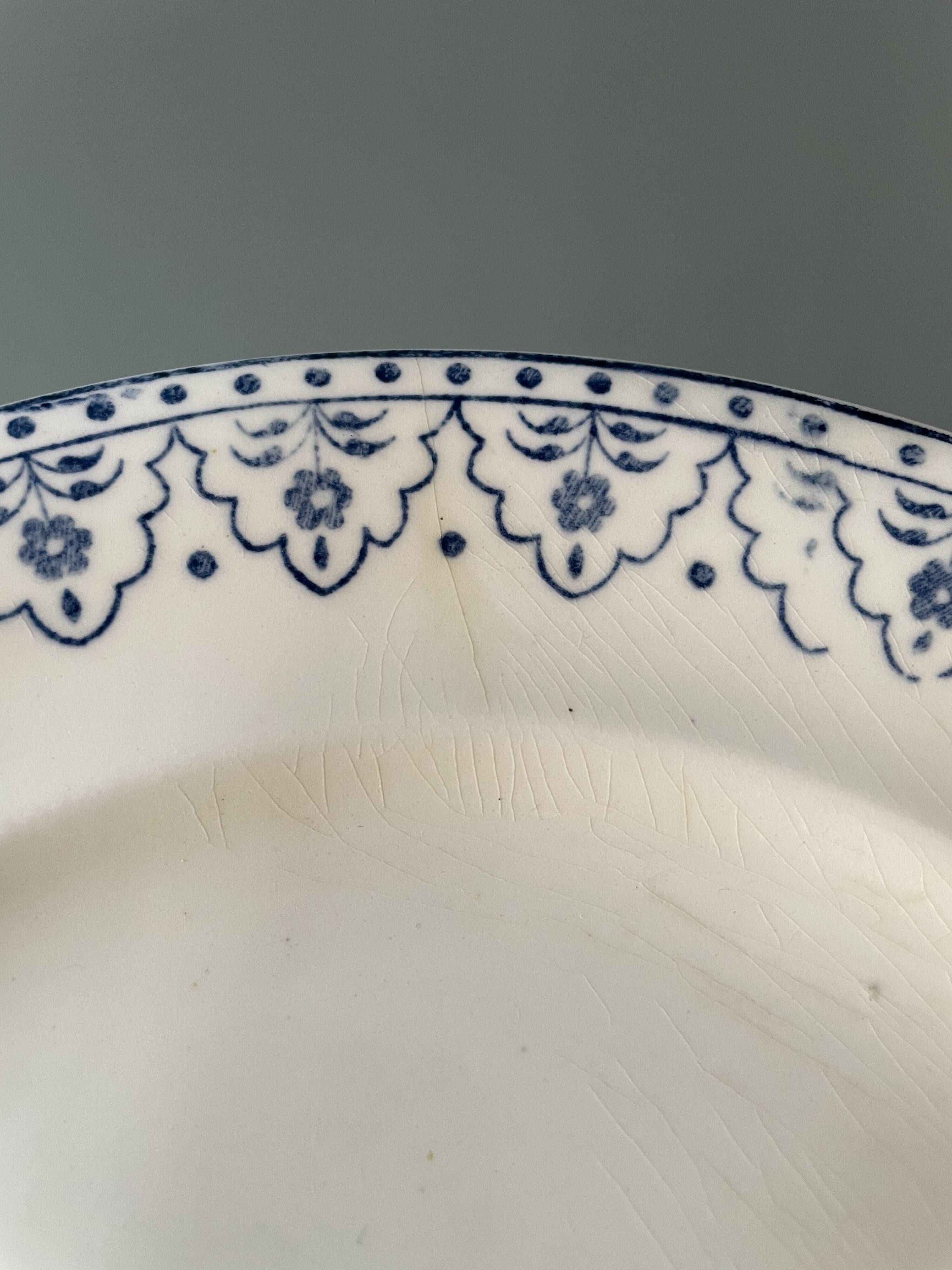 Series of 12 flat plates XIXth earthenware Terre de Fer Clairefontaine