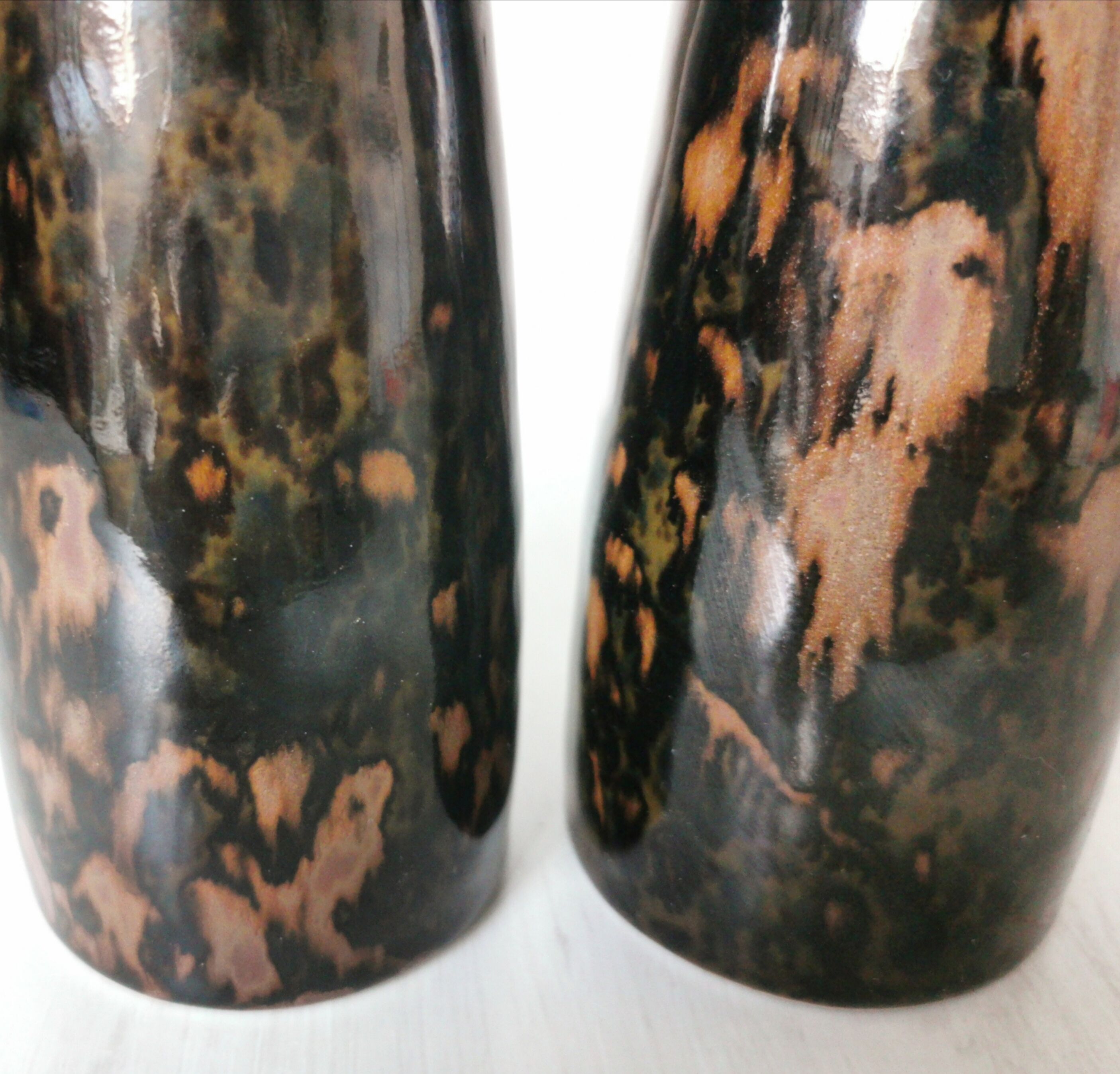 Pair of enamelled ceramic candlesticks