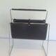 Chrome and black leather magazine rack