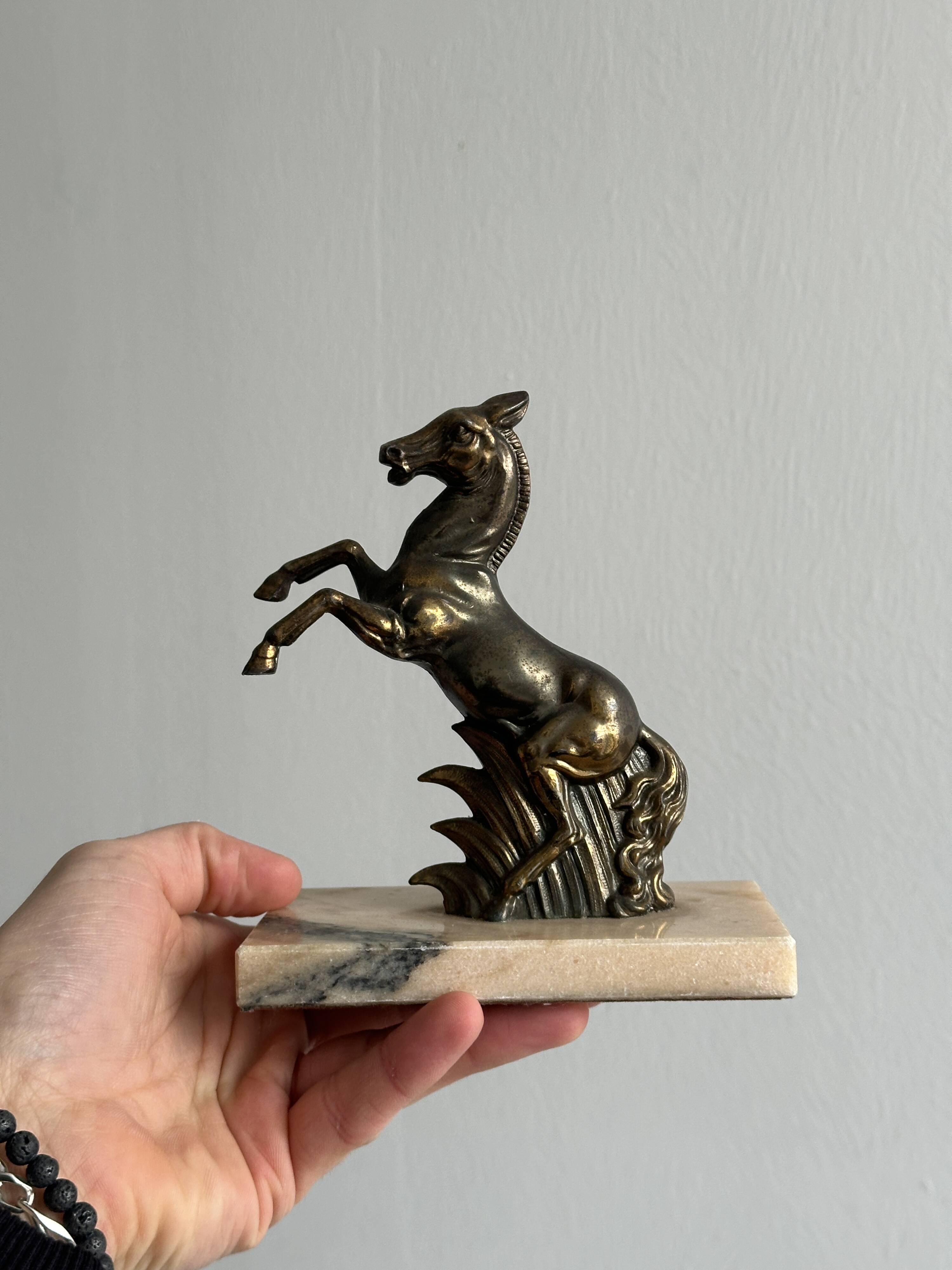 Paire de serre-livres en métal doré