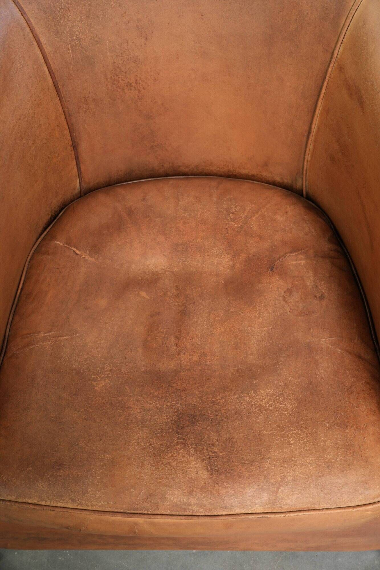 Vintage sheepskin club armchair in a beautiful light cognac colour