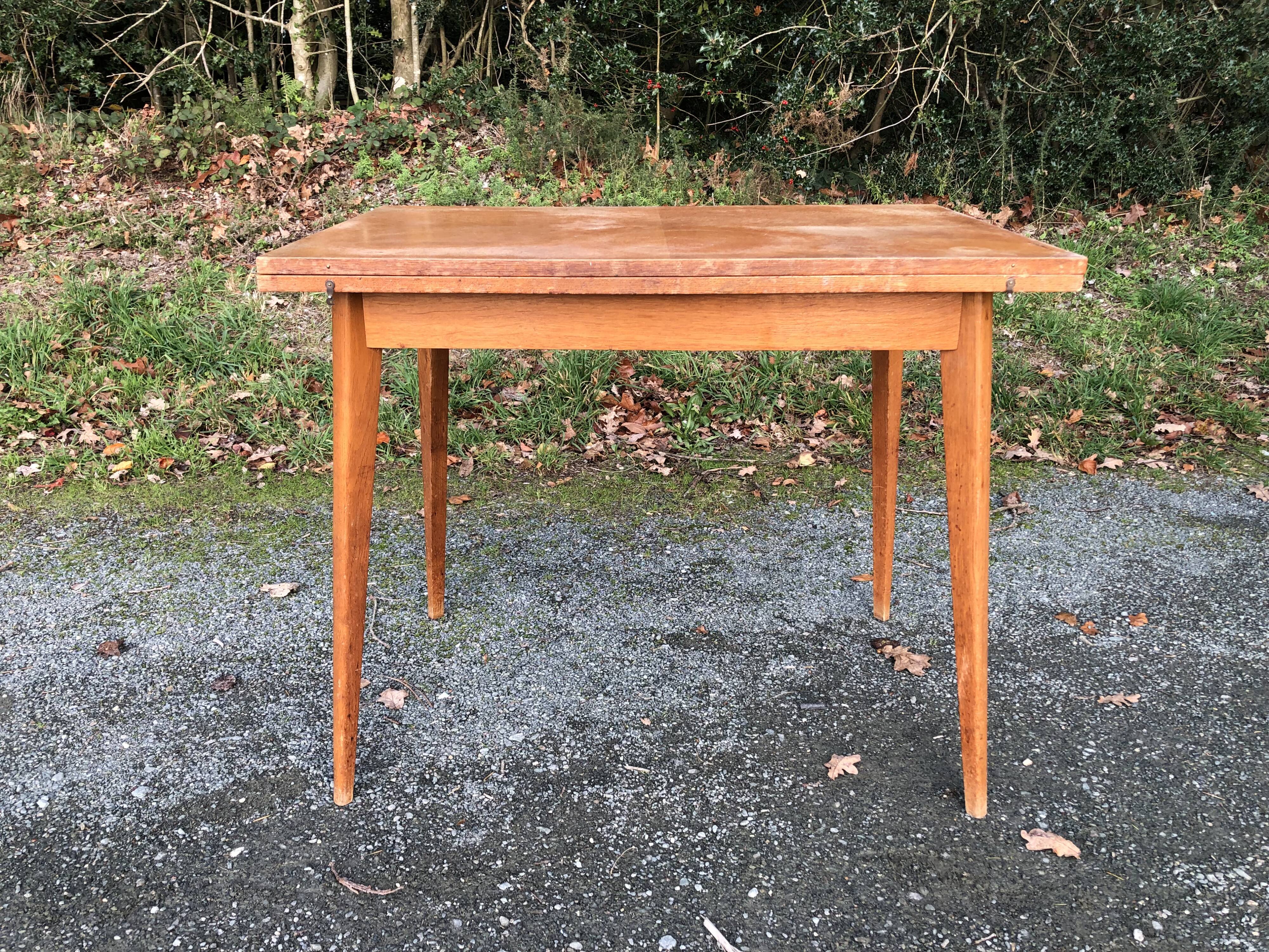 Vintage so-called portfolio table with oak compass base and its oak cp swivel top.