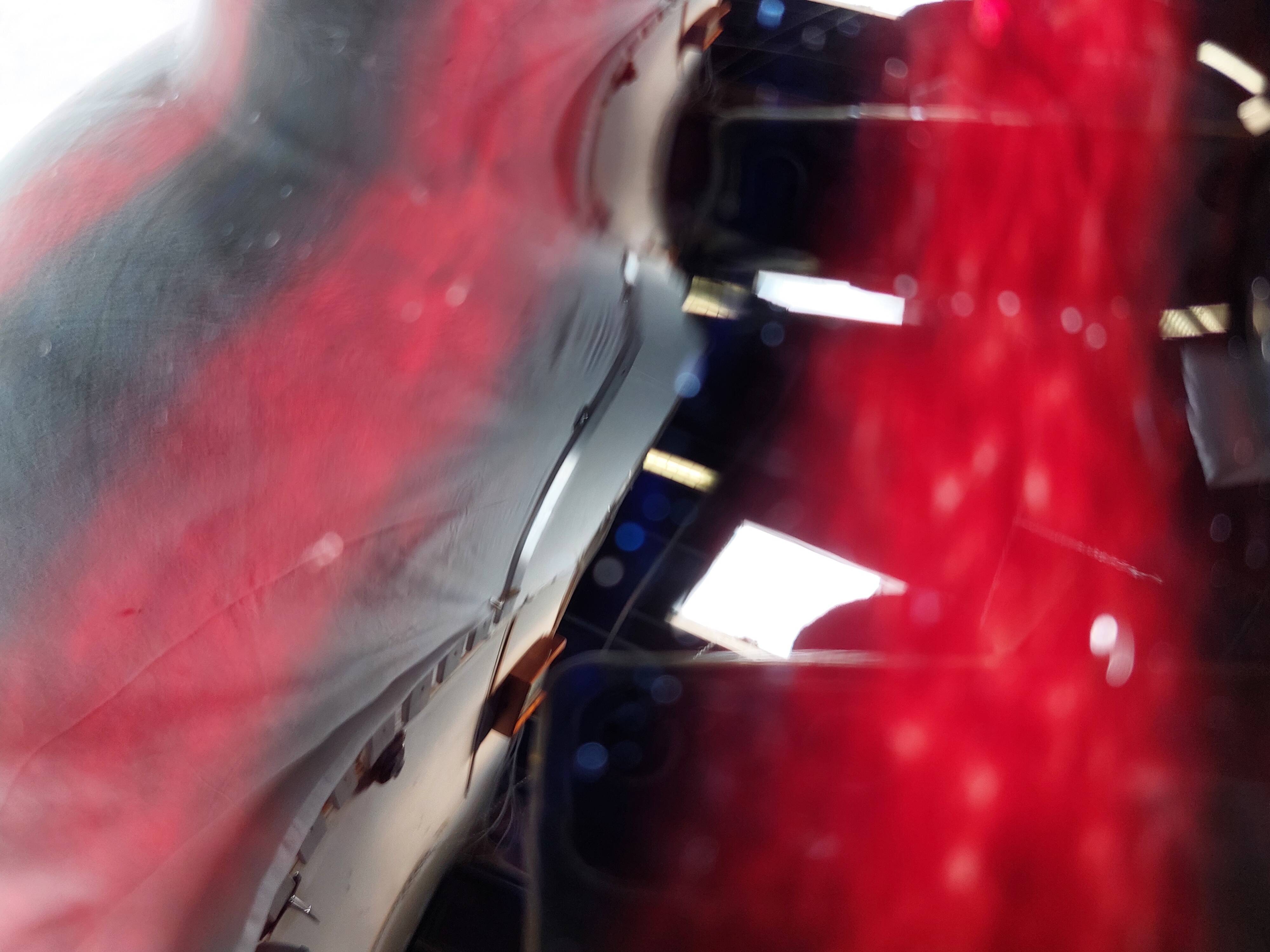 Large vintage blown glass ball vase with red and midnight blue flamed decor