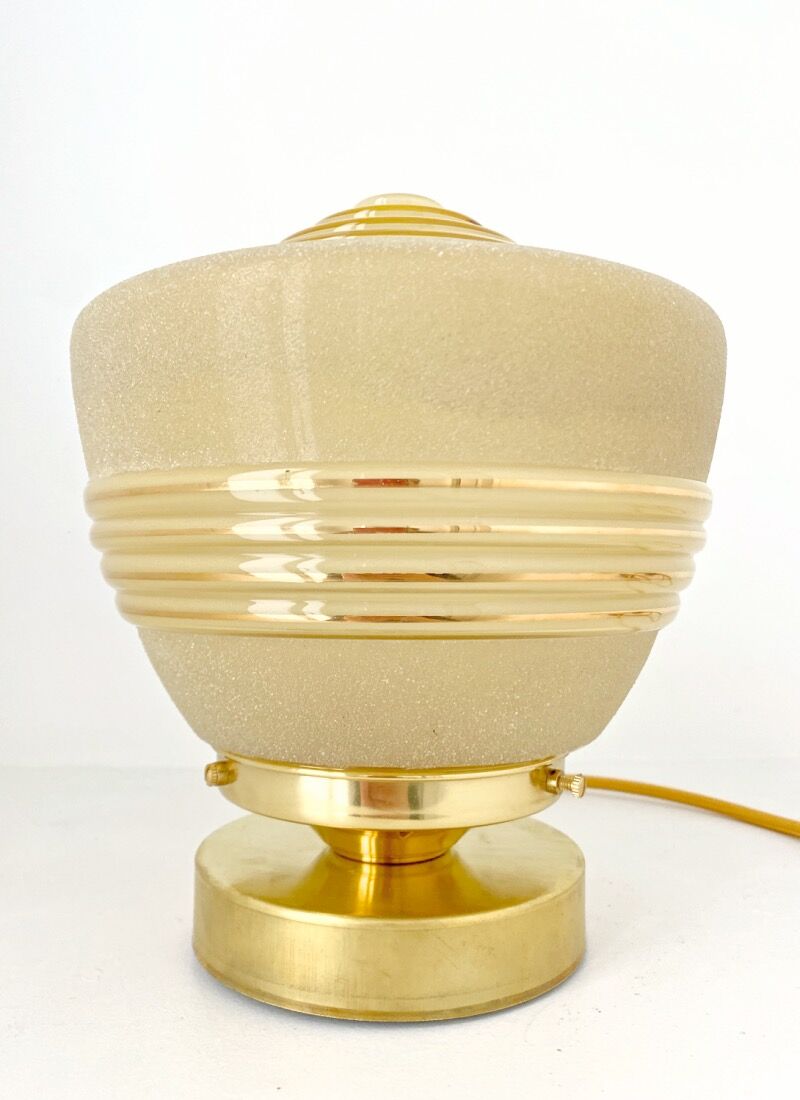 Old globe table lamp in beige and gold glass