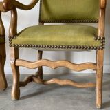Olive green upholstered armchairs with studs