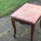 Carved wooden coffee table with shell pattern and removable pink marble top, old