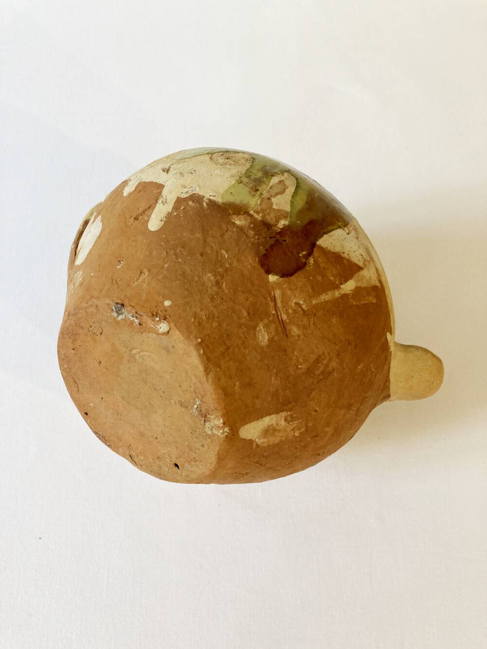 Small Provençal goat jug in creamy white and green enamelled stoneware