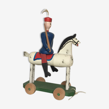 Soldier on wooden horse to shoot