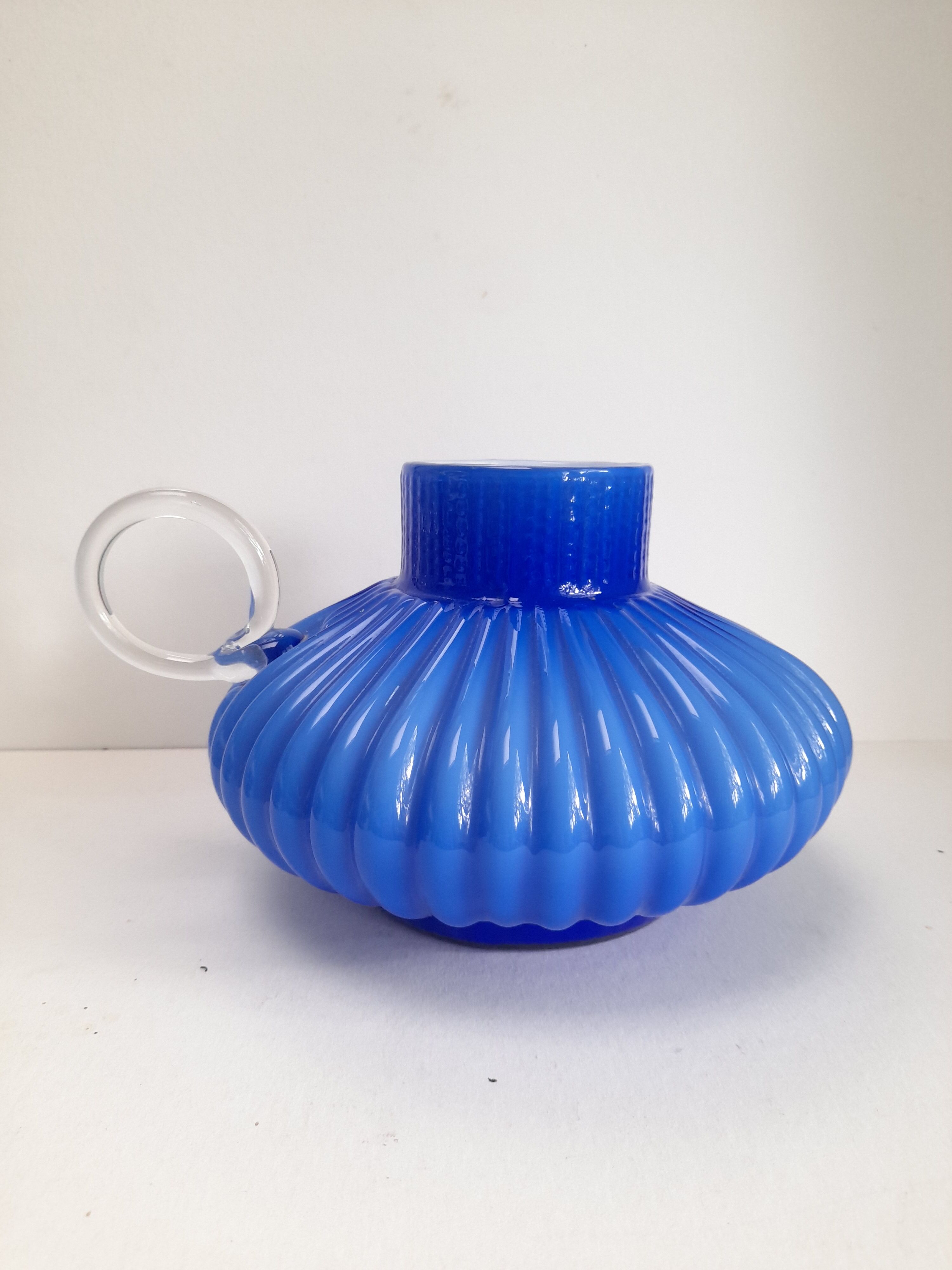 Blue opaline vase with a round handle