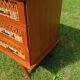 Rattan and wood splayed-leg chest of drawers