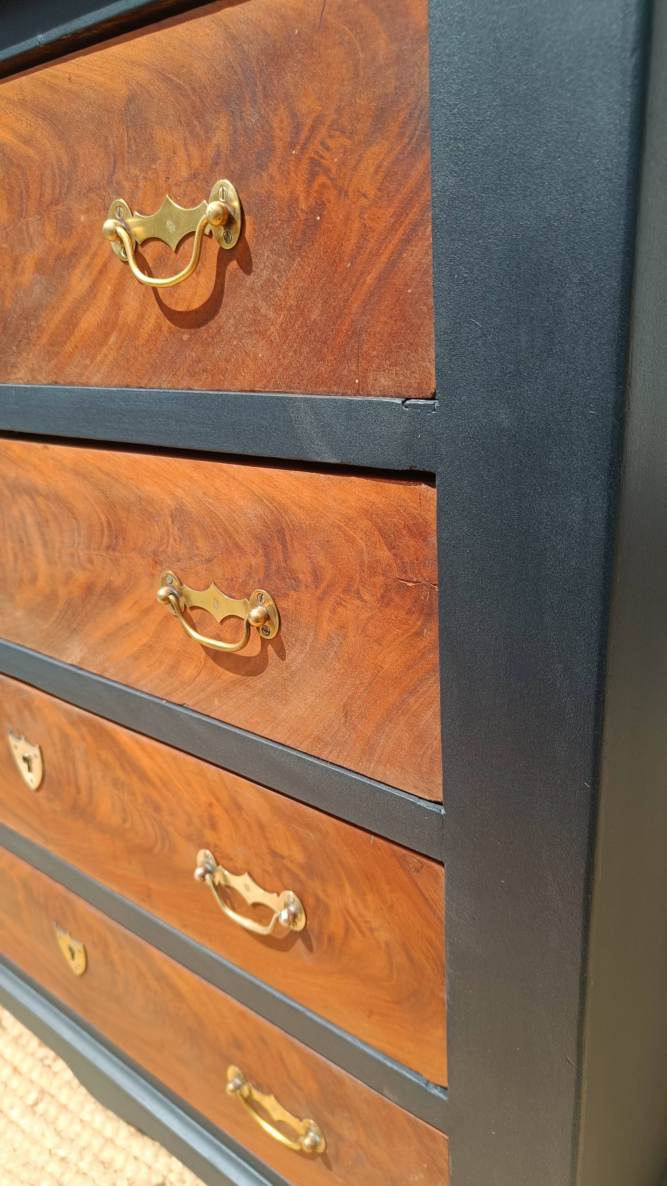 Vintage commode revamped in matte black & wood with warm tones.