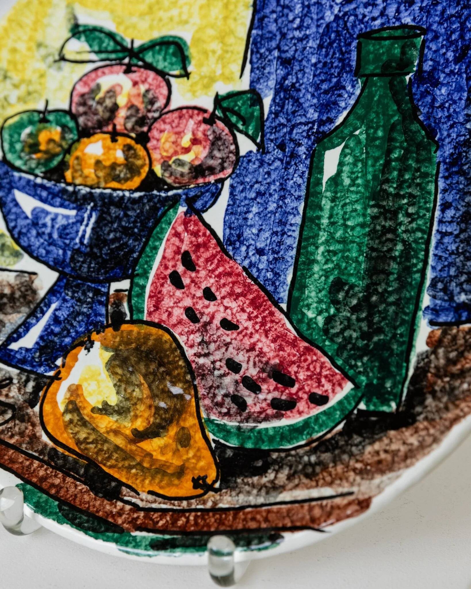 Multicolored hand-painted ceramic wall plate with 1960s Italian fruit motif, signed Stile