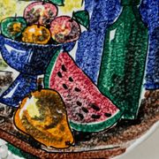 Multicolored hand-painted ceramic wall plate with 1960s Italian fruit motif, signed Stile