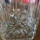 Mismatched decanter and whiskey glasses