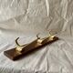 Vintage wooden wall-mounted coat rack with 3 golden cast aluminum hooks