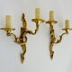 Paire d'appliques murales vintage à double feux en bronze ou laiton, feuille d'acanthes. Année 60