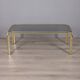 Table basse vintage des années 1970 au design italien en laiton doré et verre fumé.