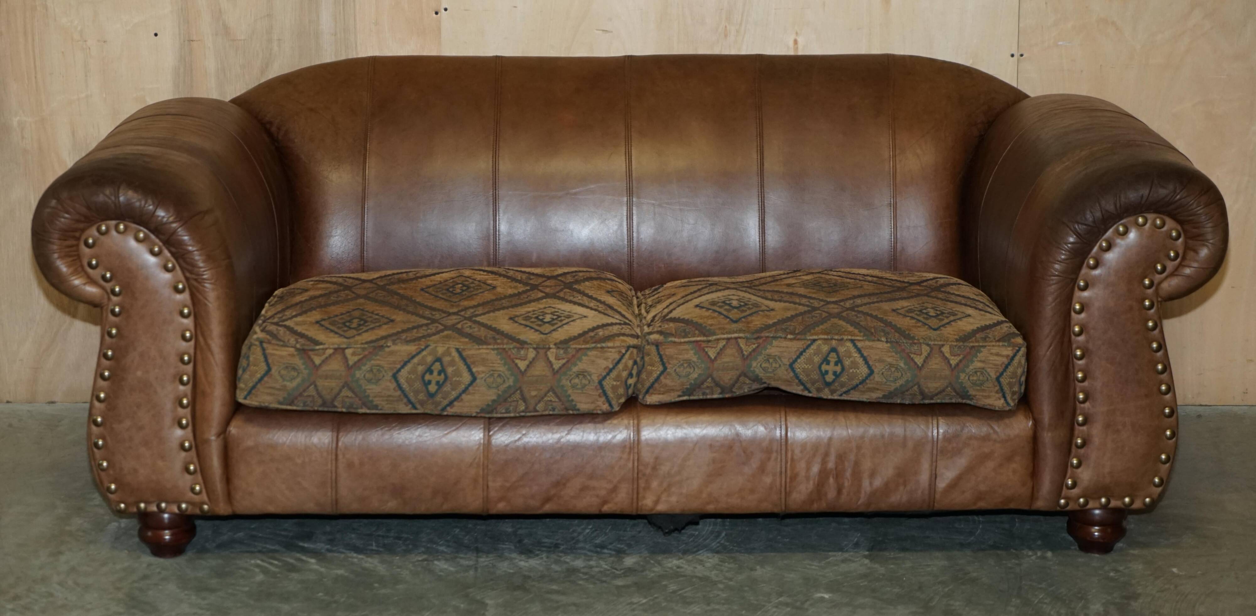 Vintage leather sofas by Thomas Lloyd with Kilim cushions.