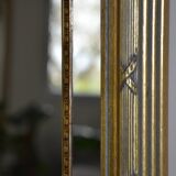 Large mirror with gilded and carved wooden glazing beads