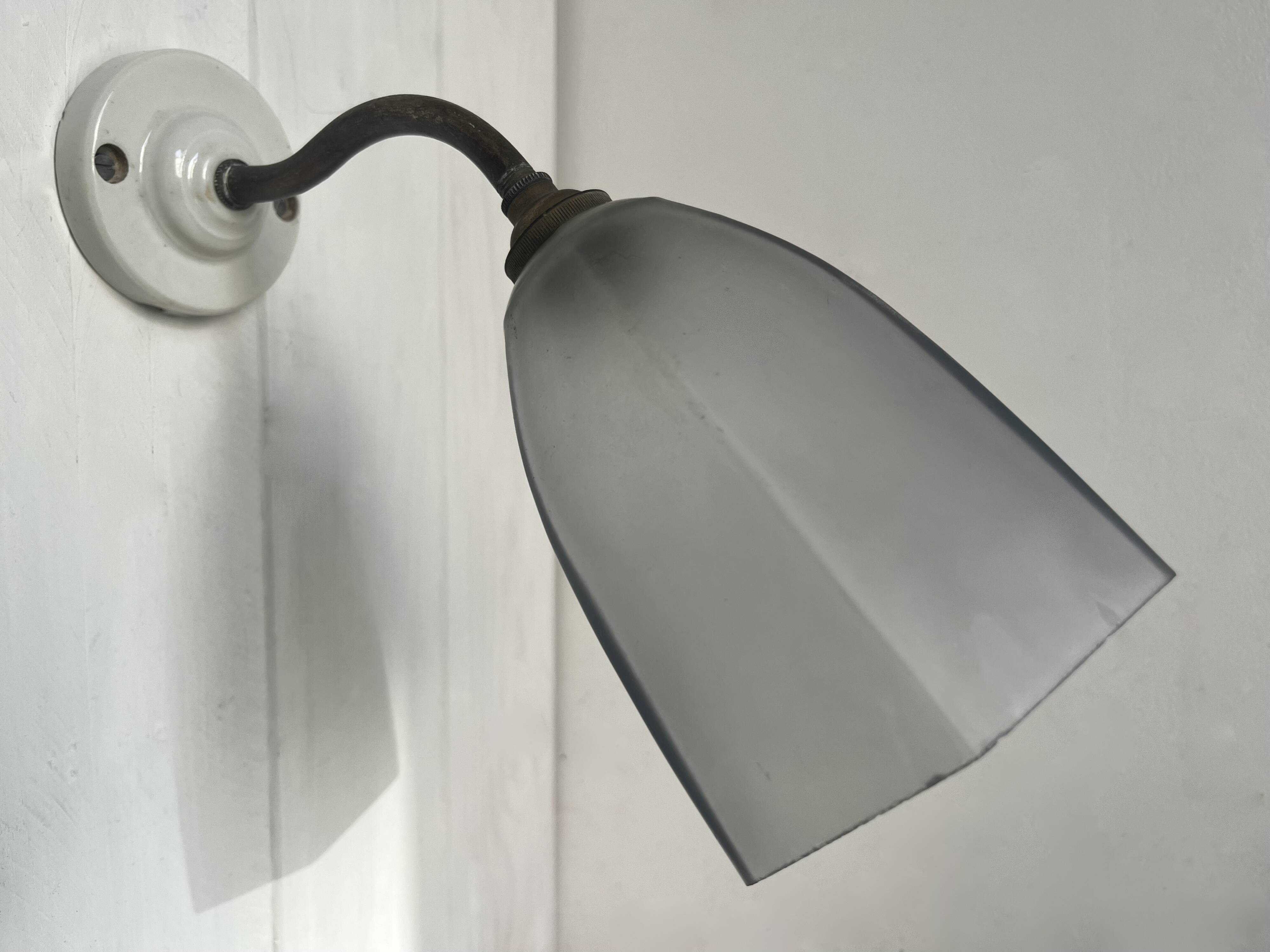 Swan neck wall light on porcelain base