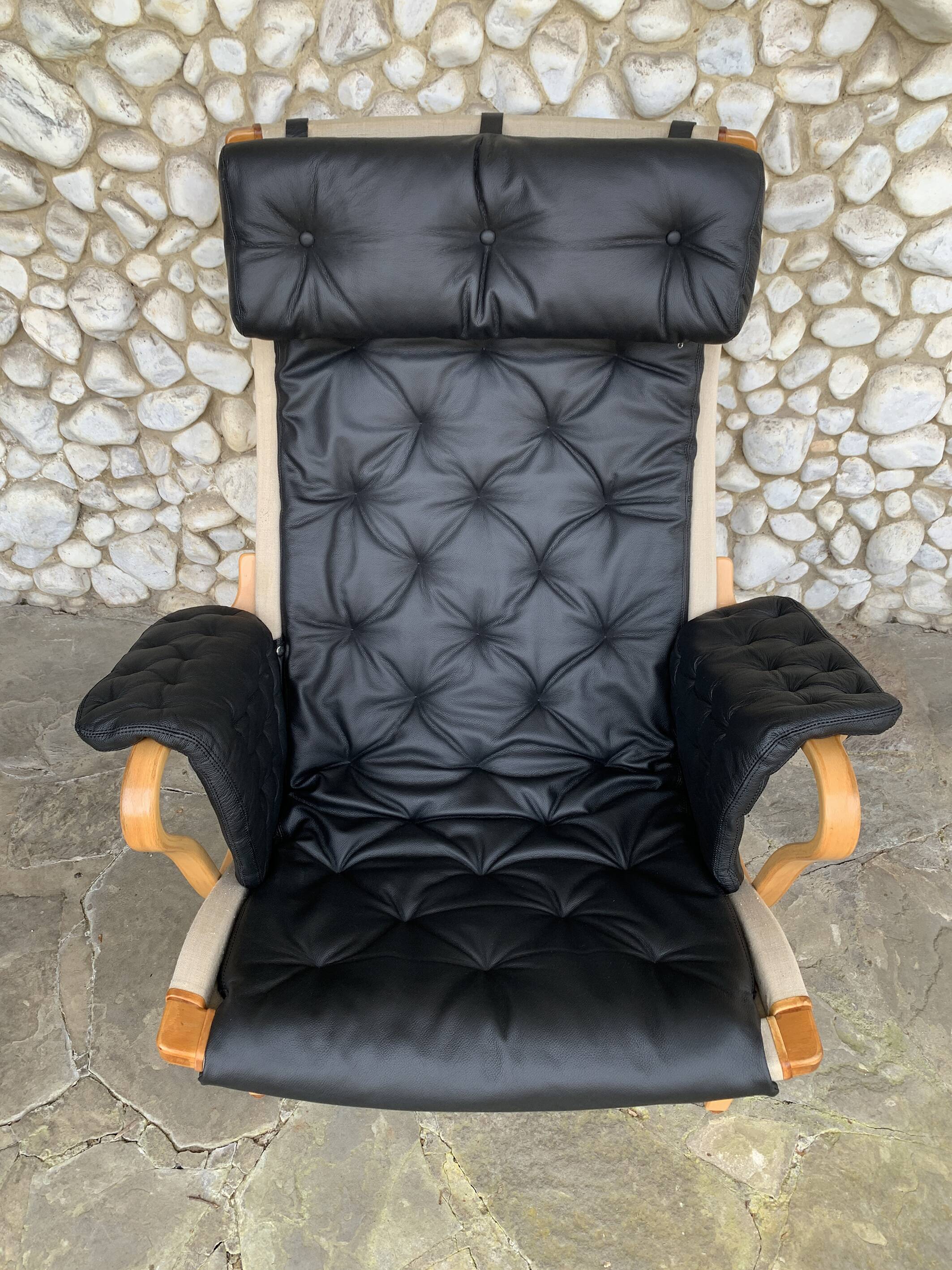 Pernilla armchair new black leather by Bruno Mathsson, Dux, Sweden 1970