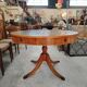 Round Regency dining table in mahogany and green leather with extensions - 20th century